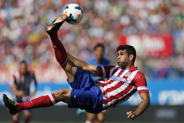 FILE - In this Sept. 14, 2013 file photo, Atletico de Madrid's Diego Costa tries an overhead kick on goal during a Spanish La Liga soccer match against Almeria at the Vicente Calderon stadium in Madrid, Spain. Atletico Madrid and Chelsea said on Thursday Sept. 21, 2017 that they have reached an agreement for the transfer of striker Diego Costa to the Spanish club who will undergo a medical and finalize the contract details with his former club. (AP Photo/Paul White, File)