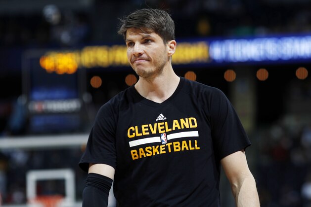 FILE - In this March 22, 2017, file photo, Cleveland Cavaliers guard Kyle Korver (26) watches during the first half of an NBA basketball game against the Denver Nuggets in Denver. A person familiar with the decision says the Cavaliers have offered free agent Kyle Korver a new contract. The person says the expected move came after the free agency negotiating period opened at 12:01 a.m. Saturday, July 1, 2017.  The person spoke to The Associated Press Saturday on condition of anonymity because the deal has not been announced.  (AP Photo/David Zalubowski, File)