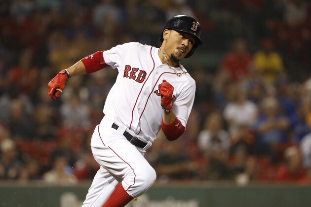 Boston Red Sox's Mookie Betts runs out a single against the Toronto Blue Jays during the first inning of a baseball game at Fenway Park in Boston, Wednesday, Sept. 6, 2017. (AP Photo/Winslow Townson)