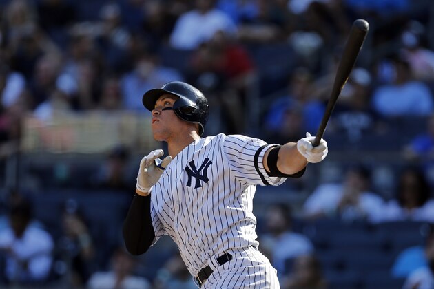 NEW YORK, NY - SEPTEMBER 25: Aaron Judge #99 of the New York Yankees hits a solo home run against the Kansas City Royals during the seventh inning at Yankee Stadium on September 25, 2017 in the Bronx borough of New York City. The home run was number 50 on the season making him the new rookie home run record holder. (Photo by Adam Hunger/Getty Images)