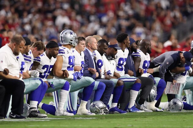 GLENDALE, AZ - SEPTEMBER 25:  Members of the Dallas Cowboys link arms before the National Anthem at the start of the NFL game against the Arizona Cardinals at the University of Phoenix Stadium on September 25, 2017 in Glendale, Arizona.  (Photo by Christian Petersen/Getty Images)