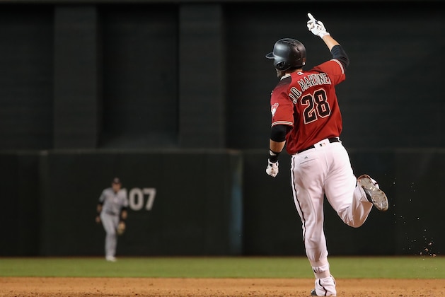 PHOENIX, AZ - SEPTEMBER 24:  J.D. Martinez #28 of the Arizona Diamondbacks celebrates after his game winning RBI single against the Miami Marlins during the ninth inning of MLB game at Chase Field on September 24, 2017 in Phoenix, Arizona.  The Diamondbacks defeated the Marlins 3-2.  (Photo by Christian Petersen/Getty Images)