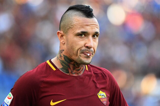 AS Roma's midfielder from Belgium Radja Nainggolan spits during the Italian Serie A football match AS Roma vs Udinese on September 23, 2017 at the Olympic stadium in Rome.  / AFP PHOTO / Vincenzo PINTO        (Photo credit should read VINCENZO PINTO/AFP/Getty Images)