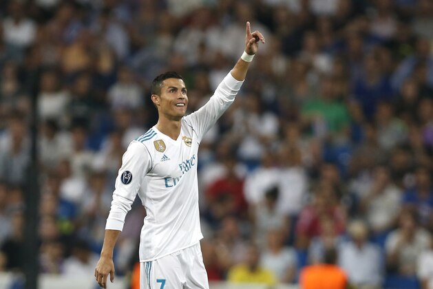 Real Madrid's Cristiano Ronaldo celebrates scoring his side's 2nd goal during a Champions League group H soccer match between Real Madrid and Apoel Nicosia at the Santiago Bernabeu stadium in Madrid, Spain, Wednesday, Sept. 13, 2017. (AP Photo/Francisco Seco)