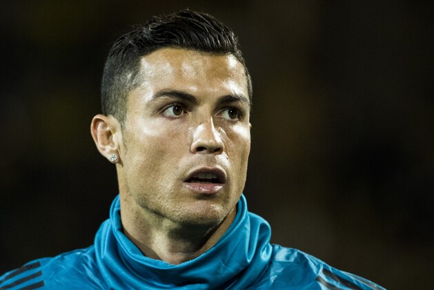 Real Madrid's Portuguese forward Ronaldo warms up prior the UEFA Champions League Group H football match BVB Borussia Dortmund v Real Madrid in Dortmund, western Germany on September 26, 2017. / AFP PHOTO / Odd ANDERSEN        (Photo credit should read ODD ANDERSEN/AFP/Getty Images)