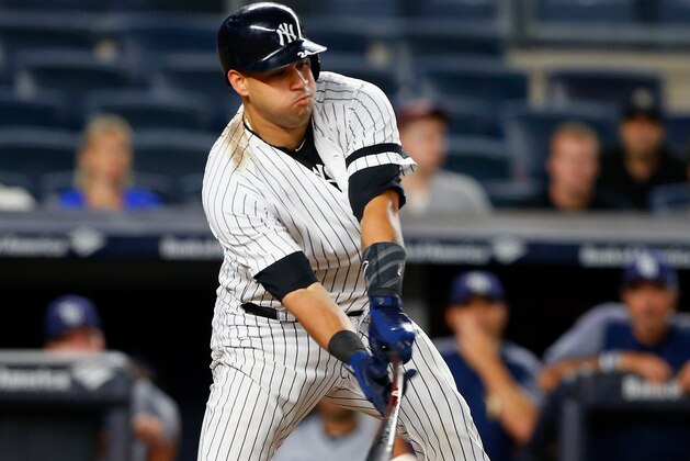 NEW YORK, NY - SEPTEMBER 26:  Gary Sanchez #24 of the New York Yankees connects on an eighth inning RBI single against the Tampa Bay Rays at Yankee Stadium on September 26, 2017 in the Bronx borough of New York City.  (Photo by Jim McIsaac/Getty Images)