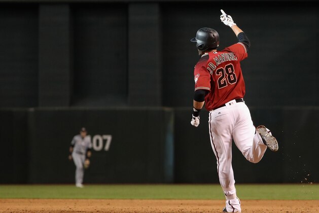 PHOENIX, AZ - SEPTEMBER 24:  J.D. Martinez #28 of the Arizona Diamondbacks celebrates after his game winning RBI single against the Miami Marlins during the ninth inning of MLB game at Chase Field on September 24, 2017 in Phoenix, Arizona.  The Diamondbacks defeated the Marlins 3-2.  (Photo by Christian Petersen/Getty Images)