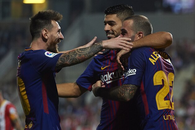 GIRONA, SPAIN - SEPTEMBER 23:  Luis Suarez of Barcelona celebrates scoring his team's second goal with his teammates Aleix Vidal (R) and Lionel Messi (L) during the La Liga match between Girona and Barcelona at Municipal de Montilivi Stadium on September 23, 2017 in Girona, Spain.  (Photo by Manuel Queimadelos Alonso/Getty Images)