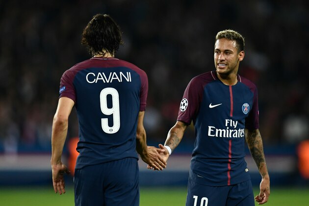 Paris Saint-Germain's Uruguayan forward Edinson Cavani (L) and Paris Saint-Germain's Brazilian forward Neymar shake hands during the UEFA Champions League football match between Paris Saint-Germain and Bayern Munich on September 27, 2017 at the Parc des Princes stadium in Paris. / AFP PHOTO / CHRISTOPHE SIMON        (Photo credit should read CHRISTOPHE SIMON/AFP/Getty Images)