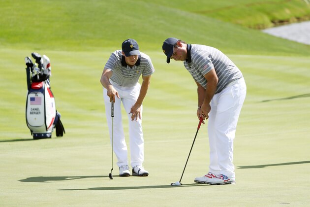 JERSEY CITY, NJ - SEPTEMBER 27:  Patrick Reed of the U.S. Team putts as Jordan Spieth of the U.S. Team looks on during practice rounds prior to the Presidents Cup at Liberty National Golf Club on September 27, 2017 in Jersey City, New Jersey.  (Photo by Sam Greenwood/Getty Images)