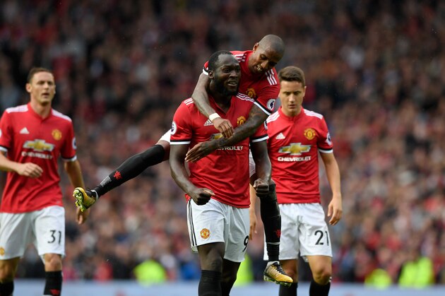 MANCHESTER, ENGLAND - SEPTEMBER 17:  Romelu Lukaku of Manchester United celebrates with Ashley Young (on back) scoring his sides third goal during the Premier League match between Manchester United and Everton at Old Trafford on September 17, 2017 in Manchester, England.  (Photo by Stu Forster/Getty Images)