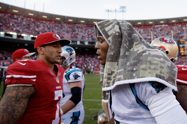 SAN FRANCISCO, CA - NOVEMBER 10:  Colin Kaepernick #7 of the San Francisco 49ers congratulates Cam Newton #1 of the Carolina Panthers after the Panthers beat the 49ers at Candlestick Park on November 10, 2013 in San Francisco, California.  (Photo by Ezra Shaw/Getty Images)