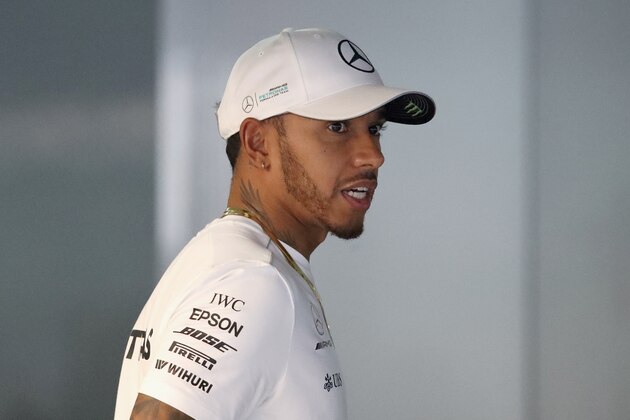 KUALA LUMPUR, MALAYSIA - SEPTEMBER 28:  Lewis Hamilton of Great Britain and Mercedes GP talks in the garage during previews for the Malaysia Formula One Grand Prix at Sepang Circuit on September 28, 2017 in Kuala Lumpur, Malaysia.  (Photo by Clive Mason/Getty Images)
