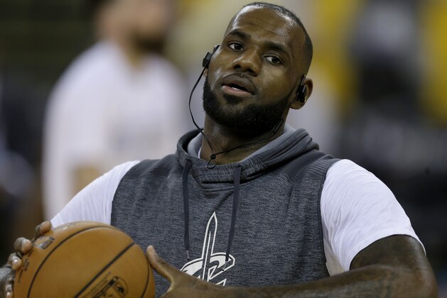 Cleveland Cavaliers forward LeBron James warms up before Game 1 of basketball's NBA Finals between the Golden State Warriors and the Cavaliers in Oakland, Calif., Thursday, June 1, 2017. (AP Photo/Ben Margot)