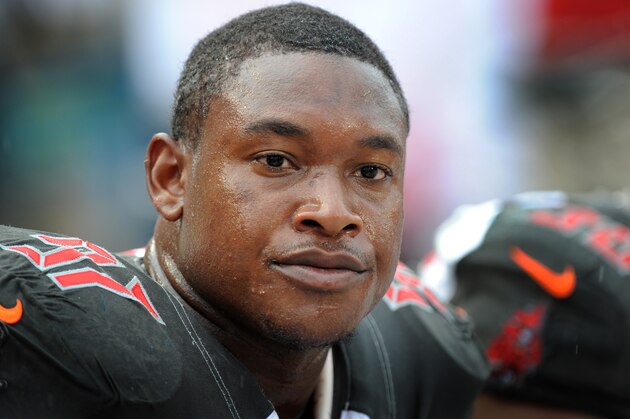 TAMPA, FL - SEPTEMBER 14: Defensive tackle Akeem Spence #97 of the Tampa Bay Buccaneers watches from the sideline against the St. Louis Rams at Raymond James Stadium on September 14, 2014 in Tampa, Florida. (Photo by Cliff McBride/Getty Images)