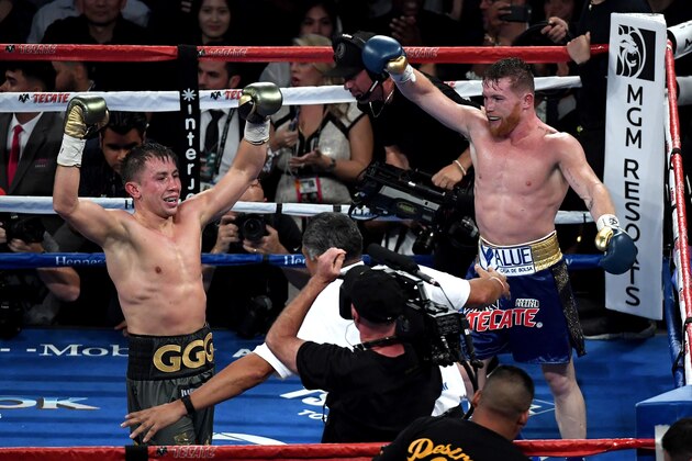 LAS VEGAS, NV - SEPTEMBER 16:  (L-R) Gennady Golovkin and Canelo Alvarez both celebrate after the final round in their WBC, WBA and IBF middleweight championship bout at T-Mobile Arena on September 16, 2017 in Las Vegas, Nevada.  (Photo by Ethan Miller/Getty Images)