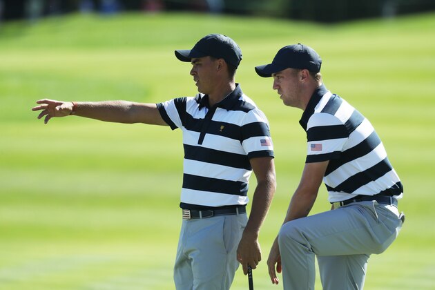 JERSEY CITY, NJ - SEPTEMBER 28:  Rickie Fowler and Justin Thomas of the U.S. Team talk on the eighth green as they play against Hideki Matsuyama of Japan and the International Team and Charl Schwartzel of South Africa and the International Team during Thursday foursome matches of the Presidents Cup at Liberty National Golf Club on September 28, 2017 in Jersey City, New Jersey.  (Photo by Rob Carr/Getty Images)
