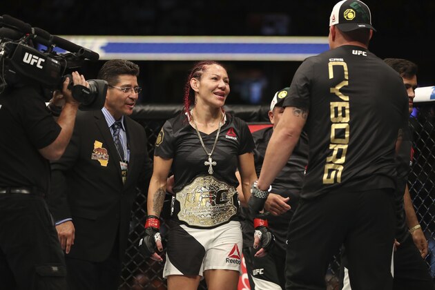 ANAHEIM, CA - JULY 29:  Cris Cyborg of Brazil celebrates after defeating Tonya Evinger in their UFC women's featherweight championship bout during the UFC 214 event inside the Honda Center on July 29, 2017 in Anaheim, California. (Photo by Christian Petersen/Zuffa LLC/Zuffa LLC via Getty Images)