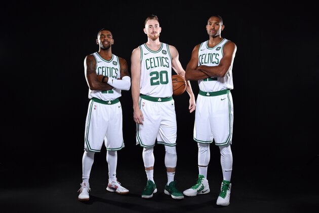 BOSTON, MA - SEPTEMBER 25: Gordon Hayward #20, Kyrie Irving #11 and Al Horford #42 of the Boston Celtics pose for a portrait during the 2017-18 NBA Media Day on September 25, 2017 at the TD Garden in Boston, Massachusetts.  NOTE TO USER: User expressly acknowledges and agrees that, by downloading and or using this photograph, User is consenting to the terms and conditions of the Getty Images License Agreement. Mandatory Copyright Notice: Copyright 2017 NBAE  (Photo by Brian Babineau/NBAE via Getty Images)