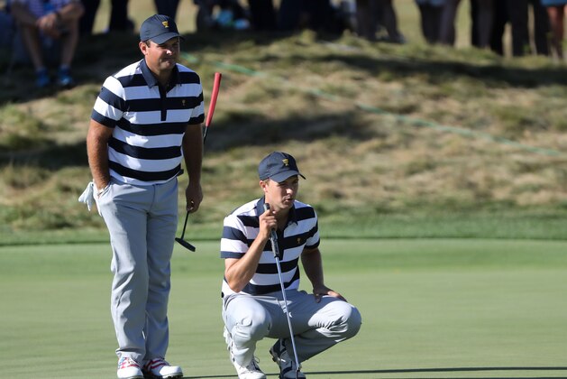 JERSEY CITY, NJ - SEPTEMBER 28:  Patrick Reed and Jordan Spieth of the U.S. Team line up a putt during Thursday foursome matches of the Presidents Cup at Liberty National Golf Club on September 28, 2017 in Jersey City, New Jersey.  (Photo by Sam Greenwood/Getty Images)