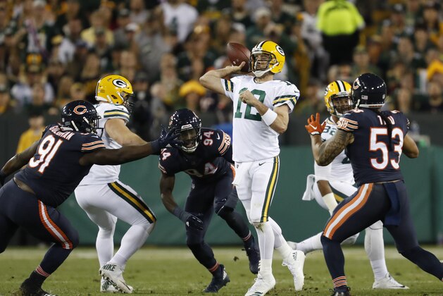 Green Bay Packers' Aaron Rodgers throws during the first half of an NFL football game against the Chicago Bears Thursday, Sept. 28, 2017, in Green Bay, Wis. (AP Photo/Matt Ludtke)