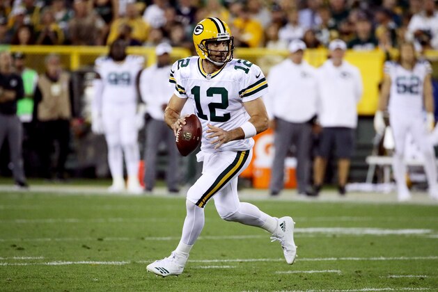 GREEN BAY, WI - SEPTEMBER 28:  Aaron Rodgers #12 of the Green Bay Packers drops back to pass in the first quarter against the Chicago Bears at Lambeau Field on September 28, 2017 in Green Bay, Wisconsin.  (Photo by Jonathan Daniel/Getty Images)