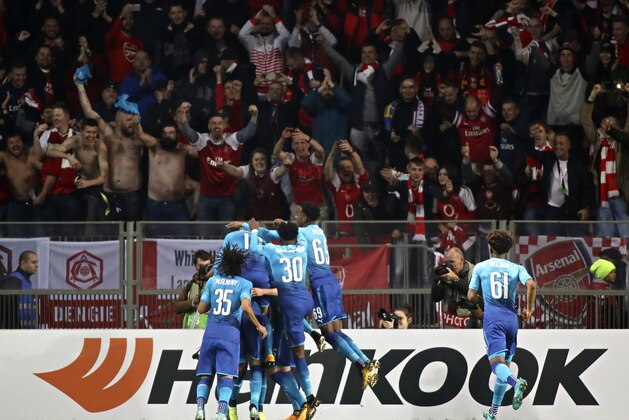 Arsenal players celebrate after scoring their third goal during the Europa League group H soccer match between Bate and Arsenal at the Borisov-Arena stadium in Borisov, Belarus, Thursday, Sept. 28, 2017. (AP Photo/Sergei Grits)