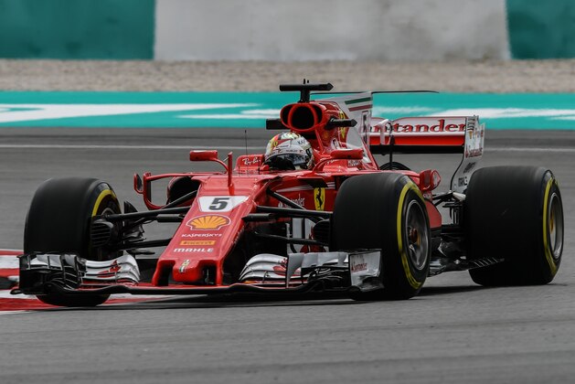 Ferrari's German driver Sebastian Vettel drives during the second practice session of the Formula One Malaysia Grand Prix in Sepang on September 29, 2017.  / AFP PHOTO / MOHD RASFAN        (Photo credit should read MOHD RASFAN/AFP/Getty Images)