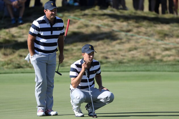 JERSEY CITY, NJ - SEPTEMBER 28:  Patrick Reed and Jordan Spieth of the U.S. Team line up a putt during Thursday foursome matches of the Presidents Cup at Liberty National Golf Club on September 28, 2017 in Jersey City, New Jersey.  (Photo by Sam Greenwood/Getty Images)