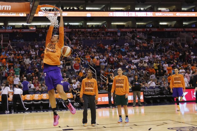West's Brittney Griner, of the Phoenix Mercury, dunks during warm up's prior to the WNBA All-Star basketball game, Saturday, July 19, 2014, in Phoenix. (AP Photo/Matt York)