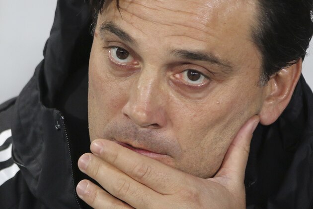 AC Milan coach Vincenzo Montella waits for the start of the Europa League group D first leg soccer match between Austria Vienna and AC Milan at the Ernst Happel Stadium in Vienna, Austria, Thursday, Sept. 14, 2017. (AP Photo/Ronald Zak)
