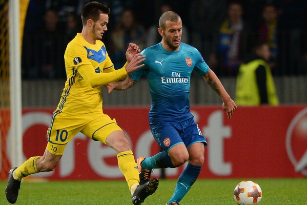 BATE Borisov's midfielder from Montenegro Mirko Ivanic (L) and Arsenal's midfielder from England Jack Wilshere vie for the ball during the UEFA Europa League Group H football match between FC BATE Borisov and Arsenal FC in Borisov, outside Minsk, on September 28, 2017. / AFP PHOTO / Maxim MALINOVSKY        (Photo credit should read MAXIM MALINOVSKY/AFP/Getty Images)