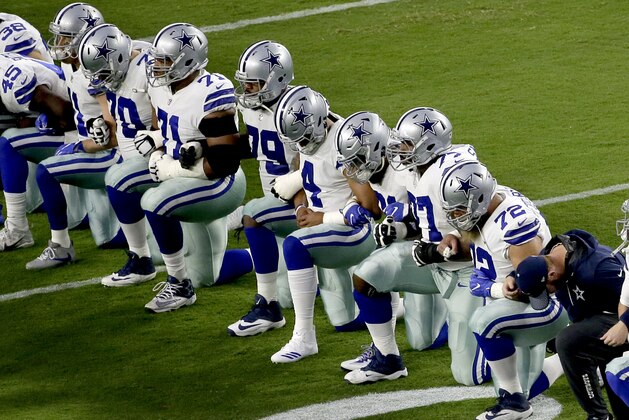 The Dallas Cowboys take a knee prior to the national anthem prior to an NFL football game against the Arizona Cardinals, Monday, Sept. 25, 2017, in Glendale, Ariz. (AP Photo/Matt York)