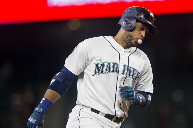 SEATTLE, WA - SEPTEMBER 21: Robinson Cano #22 of the Seattle Mariners blows a bubble as he rounds third base after hitting his 300th career home run off of Keone Kela #50 of the Texas Rangers in the ninth inning at Safeco Field on September 21, 2017 in Seattle, Washington. (Photo by Lindsey Wasson/Getty Images)