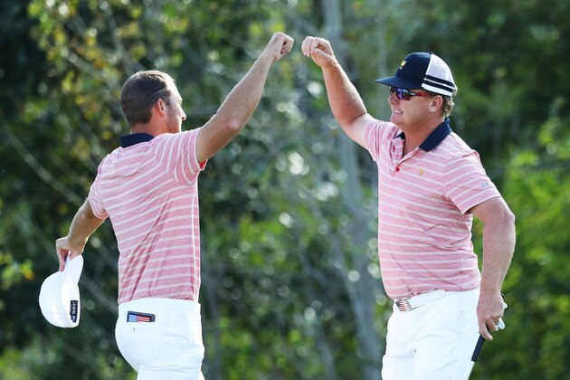 JERSEY CITY, NJ - SEPTEMBER 29:  Kevin Chappell and Charlie Hoffman of the U.S. Team celebrate on the 13th green after defeating Anirban Lahiri of India and the International Team and Charl Schwartzel of South Africa and the International Team 6&5 during Friday four-ball matches of the Presidents Cup at Liberty National Golf Club on September 29, 2017 in Jersey City, New Jersey.  (Photo by Rob Carr/Getty Images)
