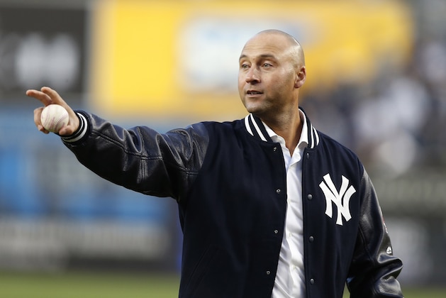 Retired New York Yankees shortstop Derek Jeter waves to the Houston Astros dugout following a pregame ceremony retiring his number 2 in Monument Park at Yankee Stadium in New York, Sunday, May 14, 2017. (AP Photo/Pool, Kathy Willens)