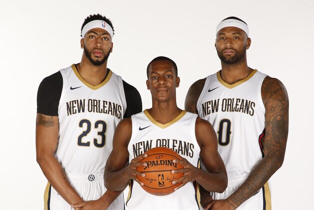 NEW ORLEANS, LA - SEPTEMBER 25: Anthony Davis #23 Rajon Rondo #9 and DeMarcus Cousins #0 of the New Orleans Pelicans pose for a portrait during media day on September 25, 2017 at Smoothie King Center in New Orleans, Louisiana. NOTE TO USER: User expressly acknowledges and agrees that, by downloading and/or using this photograph, user is consenting to the terms and conditions of the Getty Images License Agreement. Mandatory copyright notice: Copyright NBAE 2017 (Photo by Jonathan Bachman /NBAE via Getty Images)