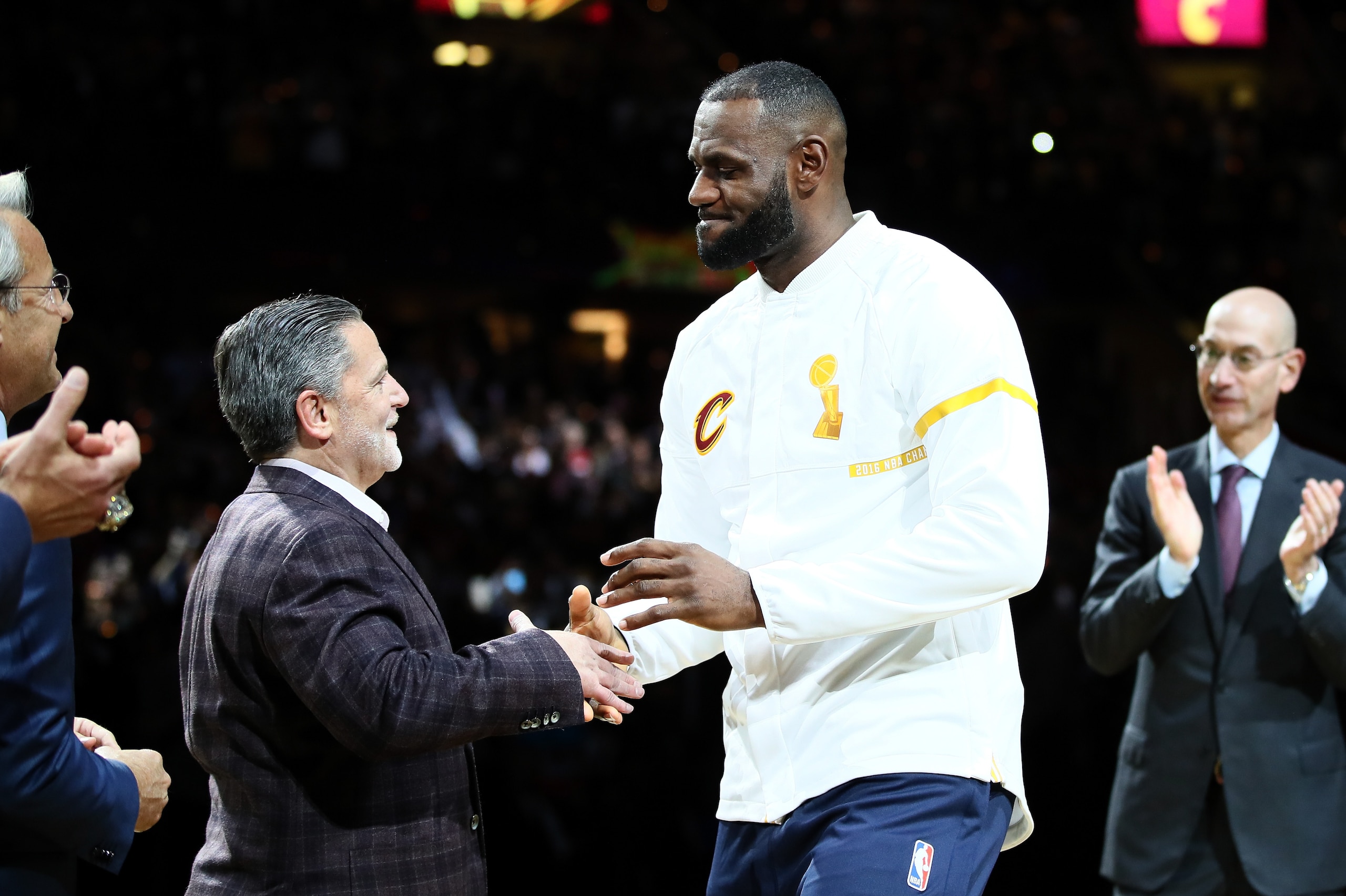 CLEVELAND, OH - OCTOBER 25: LeBron James #23 of the Cleveland Cavaliers recieves his championship ring from owner Dan Gilbert before the game against the New York Knicks at Quicken Loans Arena on October 25, 2016 in Cleveland, Ohio.   NOTE TO USER: User expressly acknowledges and agrees that, by downloading and or using this photograph, User is consenting to the terms and conditions of the Getty Images License Agreement. (Photo by Ezra Shaw/Getty Images)
