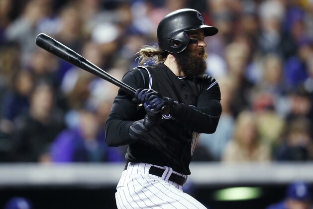 Colorado Rockies' Charlie Blackmon watches his RBI single off Los Angeles Dodgers relief pitcher Tony Cingrani during the fifth inning of a baseball game Friday, Sept. 29, 2017, in Denver. The Rockies won 9-1. (AP Photo/David Zalubowski)