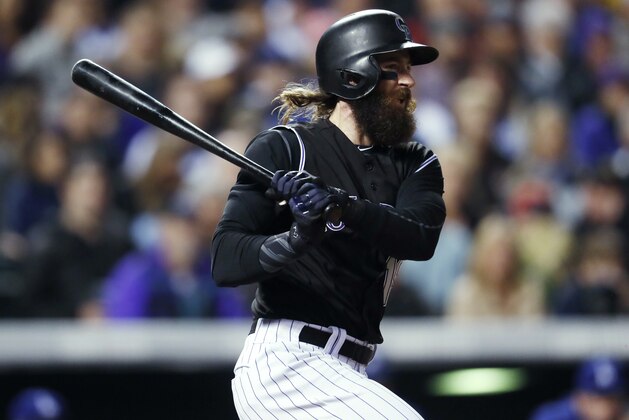 Colorado Rockies' Charlie Blackmon watches his RBI single off Los Angeles Dodgers relief pitcher Tony Cingrani during the fifth inning of a baseball game Friday, Sept. 29, 2017, in Denver. The Rockies won 9-1. (AP Photo/David Zalubowski)