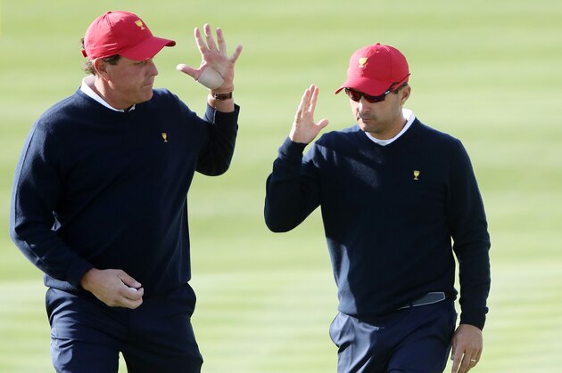 JERSEY CITY, NJ - SEPTEMBER 30:  Phil Mickelson and Kevin Kisner of the U.S. Team react on the eighth green after winning the hole against Emiliano Grillo of Argentina and the International Team and Jhonattan Vegas of Venezuela and the International Team to go all square during Saturday foursome matches of the Presidents Cup at Liberty National Golf Club on September 30, 2017 in Jersey City, New Jersey.  (Photo by Sam Greenwood/Getty Images)