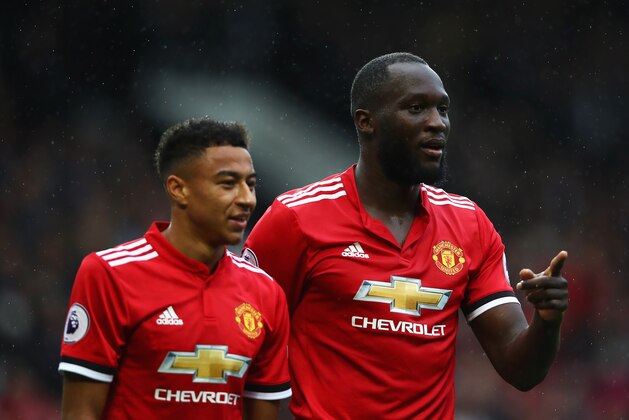 MANCHESTER, ENGLAND - SEPTEMBER 30:  Romelu Lukaku (R) of Manchester United celebrates scoring his side's fourth goal with his team mate Jesse Lingard (L) during the Premier League match between Manchester United and Crystal Palace at Old Trafford on September 30, 2017 in Manchester, England.  (Photo by Clive Brunskill/Getty Images)