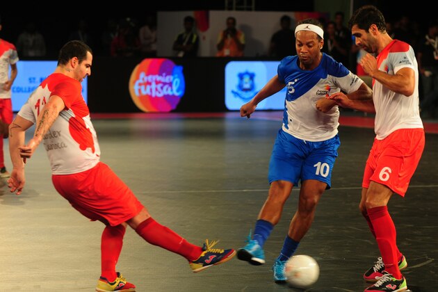 Ronaldhino (2R) from the Goa 5's plays against Kolkata 5's during their Premier Futsal Football League match in Chennai on July 15, 2016. / AFP / ARUN SANKAR        (Photo credit should read ARUN SANKAR/AFP/Getty Images)