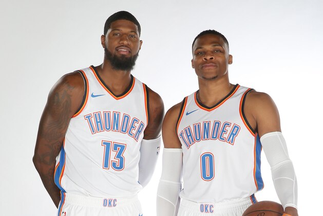 OKLAHOMA CITY, OK - SEPTEMBER 25: Paul George #13 and Russell Westbrook #0 of the Oklahoma City Thunder pose for a portrait during 2017 NBA Media Day on September 25, 2017 at the Chesapeake Energy Arena in Oklahoma City, Oklahoma. NOTE TO USER: User expressly acknowledges and agrees that, by downloading and or using this Photograph, user is consenting to the terms and conditions of the Getty Images License Agreement. Mandatory Copyright Notice: Copyright 2017 NBAE (Photo by Layne Murdoch/NBAE via Getty Images)