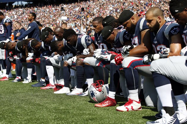 Several New England Patriots players kneel during the national anthem before an NFL football game against the Houston Texans, Sunday, Sept. 24, 2017, in Foxborough, Mass. (AP Photo/Michael Dwyer)
