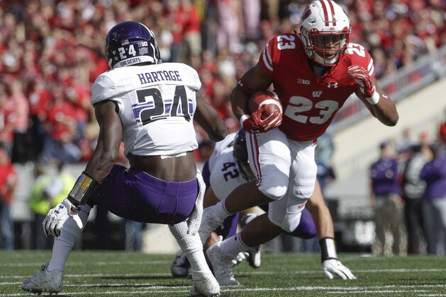 Wisconsin's Jonathan Taylor runs during the first half of an NCAA college football game against Northwestern Saturday, Sept. 30, 2017, in Madison, Wis. (AP Photo/Morry Gash)