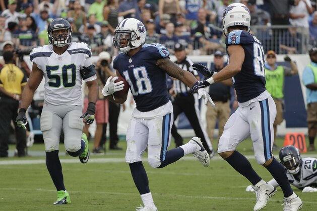 Tennessee Titans wide receiver Rishard Matthews (18) scores a touchdown on a 55-yard pass ahead of Seattle Seahawks outside linebacker K.J. Wright (50) in the second half of an NFL football game Sunday, Sept. 24, 2017, in Nashville, Tenn. (AP Photo/James Kenney)