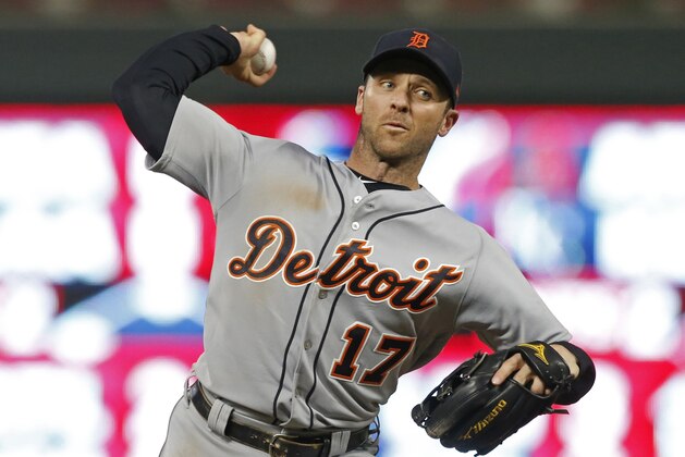 Detroit Tigers' Andrew Romine pitches against the Minnesota Twins during the eighth inning of a baseball game Saturday, Sept. 30, 2017, in Minneapolis. Romine joined a select few players by playing in all nine positions during the game. The Tigers won 3-2. (AP Photo/Jim Mone)