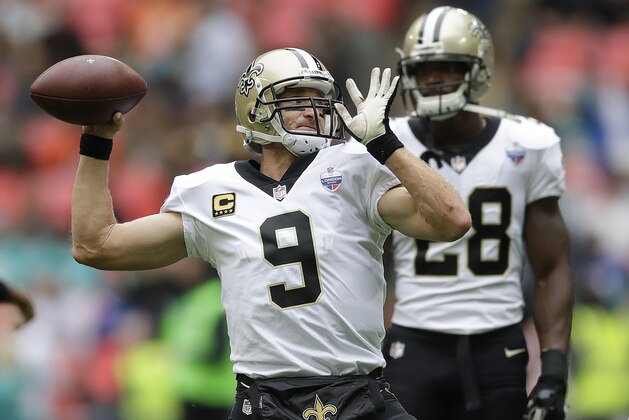 New Orleans Saints quarterback Drew Brees (9) passes the ball as he warms-up before an NFL football game against Miami Dolphins at Wembley Stadium in London, Sunday Oct. 1, 2017. (AP Photo/Matt Dunham)
