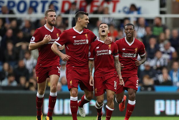 NEWCASTLE UPON TYNE, ENGLAND - OCTOBER 01:  Philippe Coutinho of Liverpool celebrates scoring his sides first goal with Dejan Lovren of Liverpool during the Premier League match between Newcastle United and Liverpool at St. James Park on October 1, 2017 in Newcastle upon Tyne, England.  (Photo by Ian MacNicol/Getty Images)